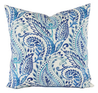 A blue floral pattern on a soft white pillow.