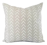 A mud cloth inspired print on a soft grey pillow.