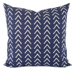 A blue pillow in a mud cloth inspired print.
