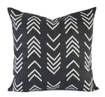 A soft black pillow with a grey mud cloth pattern.