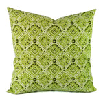 A soft green pillow with a black and grey small scale damask print.