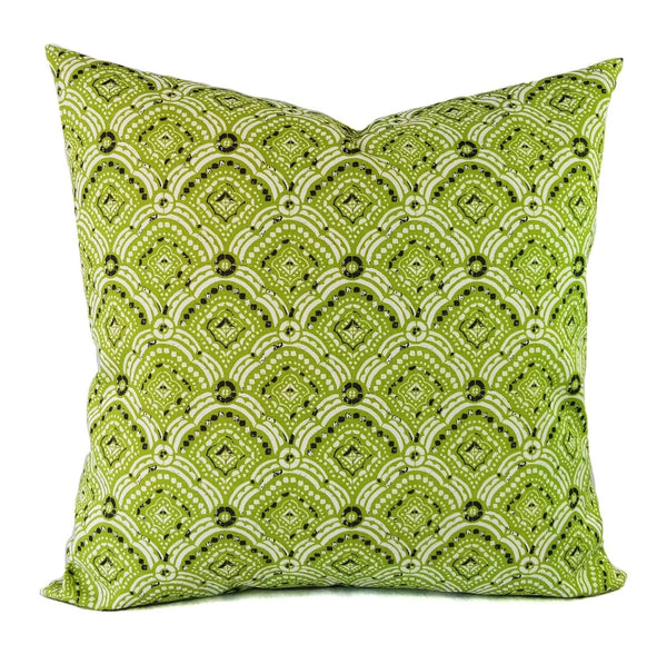 A soft green pillow with a black and grey small scale damask print.