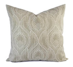 A grey taupe trellis geometric pattern pillow.